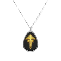 Image of oval glowing cross necklace